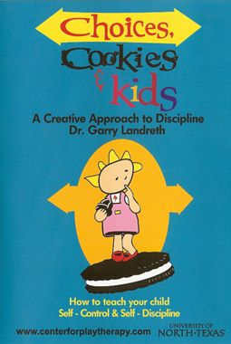 A cartoon child wearing a pink dress and red shoes is eating a cookie.